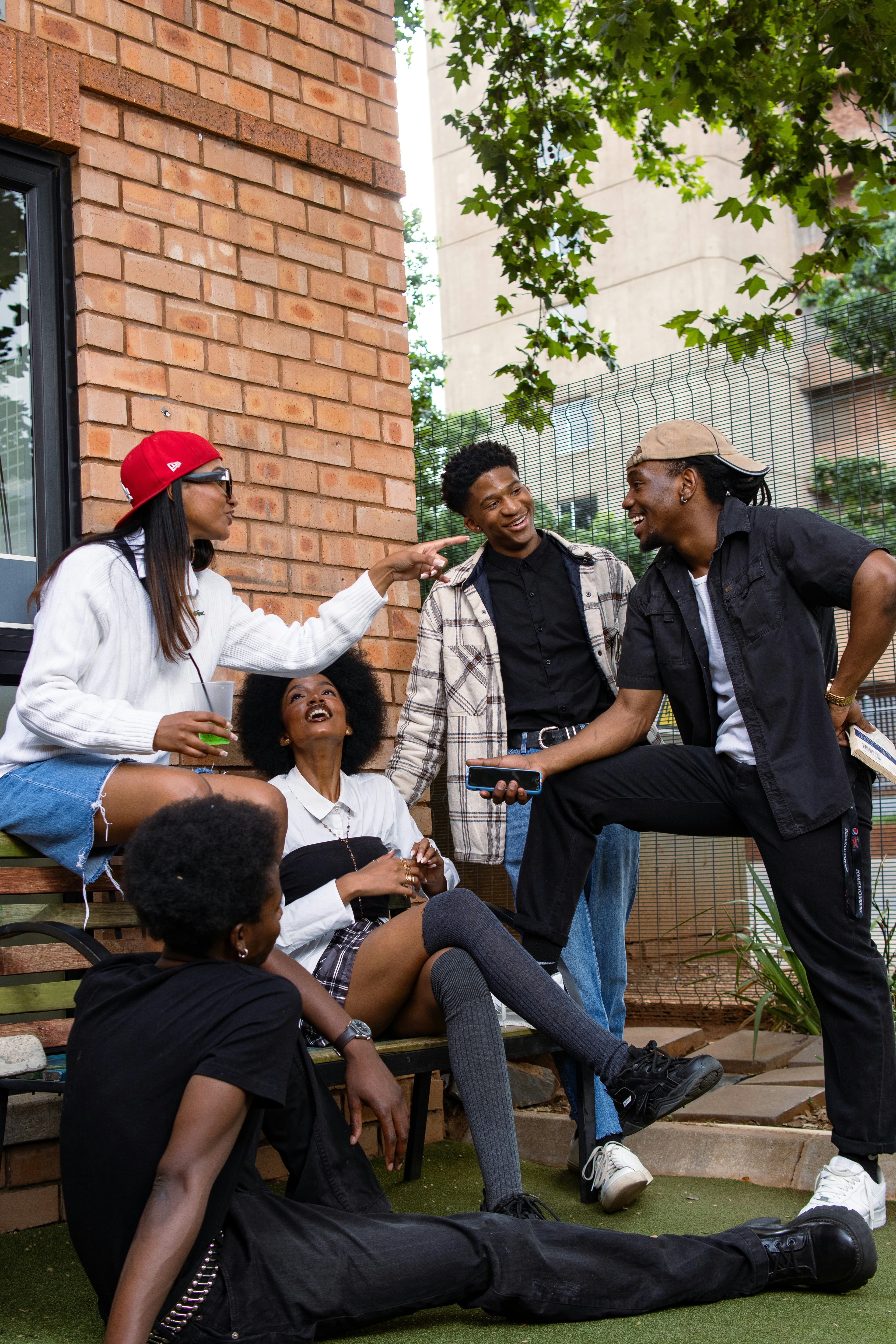 Young African friends hanging out, laughing together